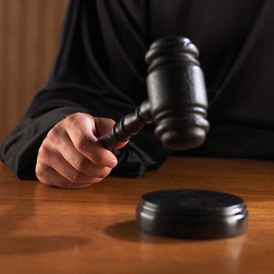 judge handing down verdict --- Image by © Royalty-Free/Corbis